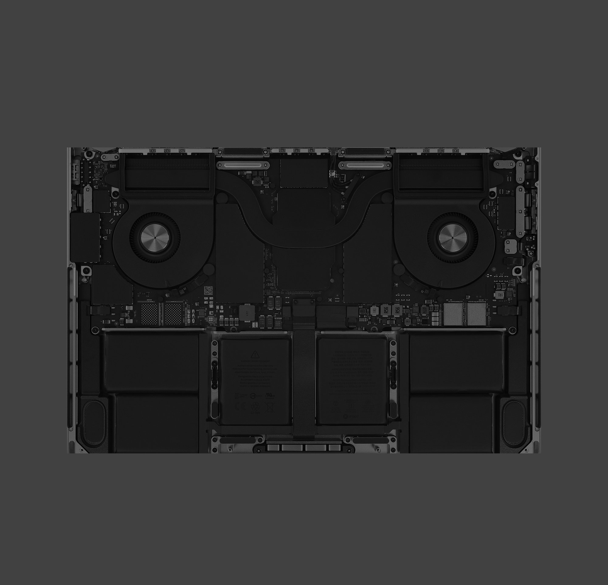 The internal components of an Apple MacBook — organised, finished, and considered even though no user will ever see them.
