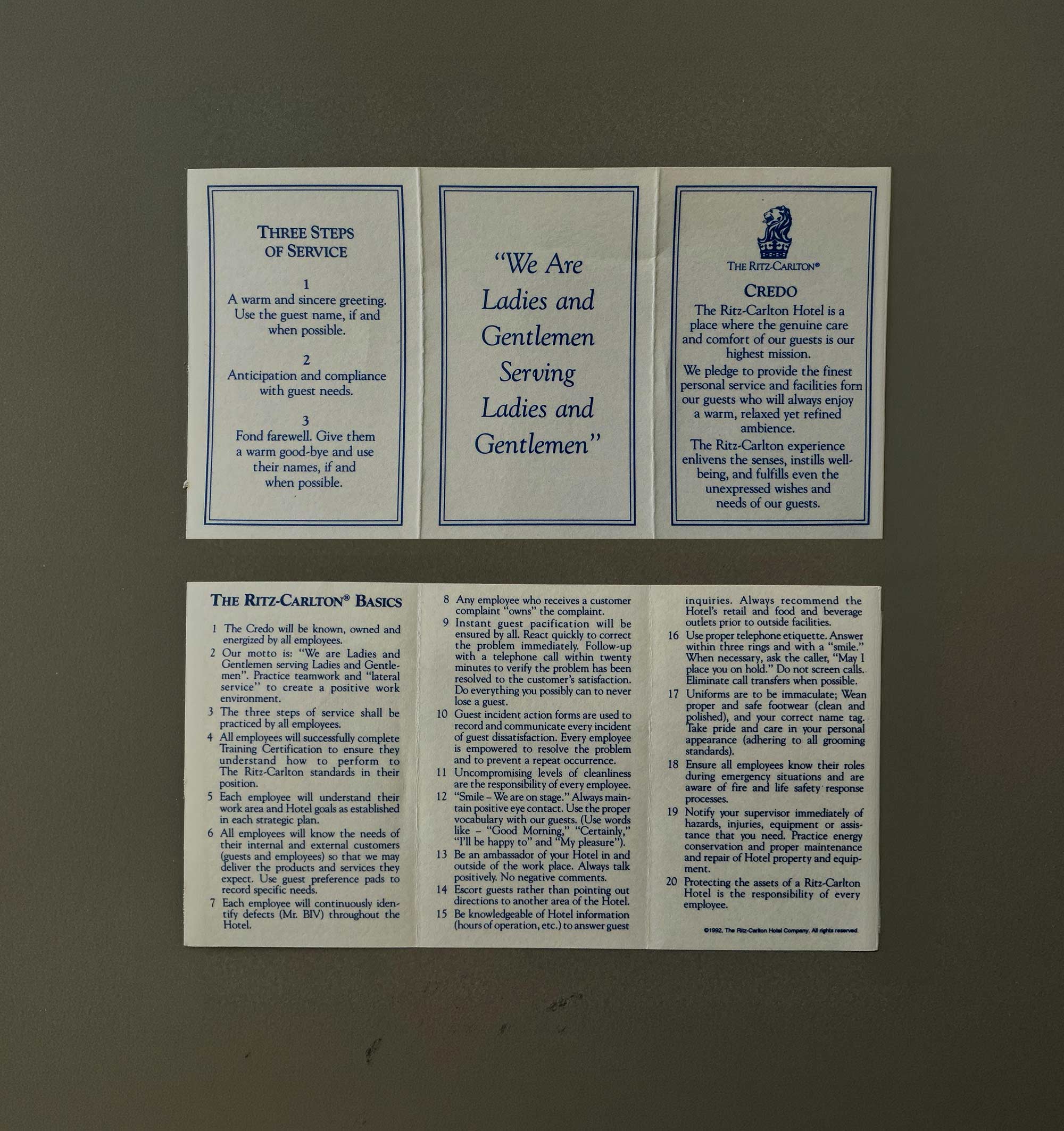 The Ritz-Carlton Credo Card, carried by every employee — a physical artifact that encodes the Gold Standards into daily service behaviour.